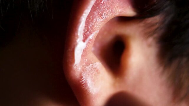Extreme close up of human ear and skin texture