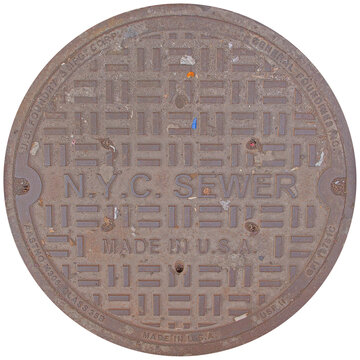 Heavy metal utility manhole cover found in new york city street with sewer cover metal hatch urban street nyc sewer street level drainage system metal lid round cover iron cover public works