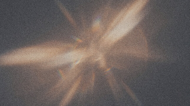 Abstract light leaks and lens flare on a dark grainy background