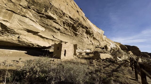 Cinematic wide shot of morning sun on Native American ruins in Chaco Canyon in New Mexico, USA