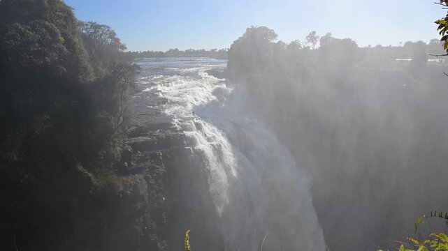 Zambezi River falling over Victoria Falls in landscape orientation