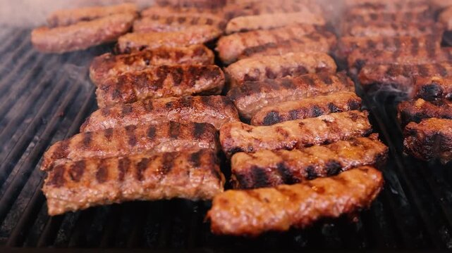 Traditional Romanian mici (grilled minced meat rolls) and susages cooking on a barbecue grill at a local fair, with smoke rising from the hot coals and the atmosphere of a Romanian outdoor food festiv