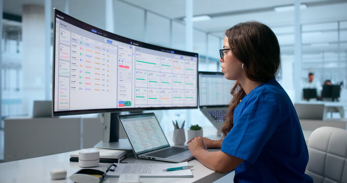 Healthcare Manager Uses Medical Software On Laptop