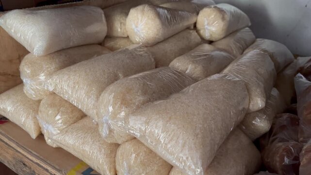 Wide Angle View of Granulated White Sugar Sacks Packaged in Clear Plastics