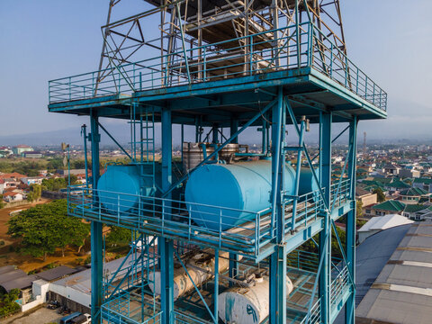 Industrial Water Treatment and Storage Tanks Featuring a Blue Steel Framework, Industrial Infrastructure View from Above.