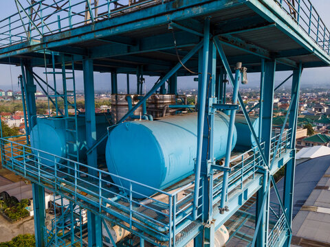 Industrial Water Treatment and Storage Tanks Featuring a Blue Steel Framework, Industrial Infrastructure View from Above.