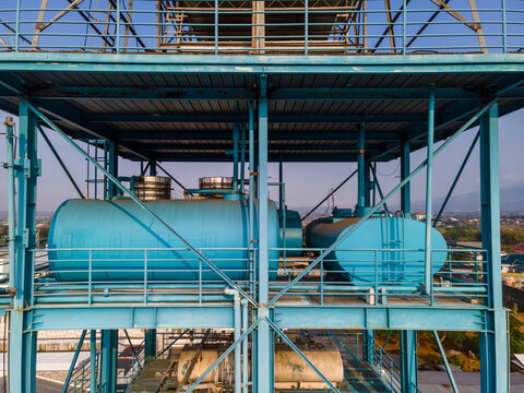 Industrial Water Treatment and Storage Tanks Featuring a Blue Steel Framework, Industrial Infrastructure View from Above.
