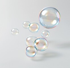Fototapeta premium Colorful soap bubbles floating against light background