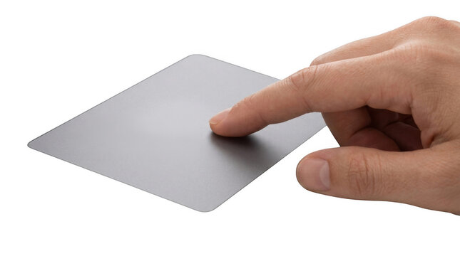 Human finger touching a sleek metallic trackpad isolated on transparent background