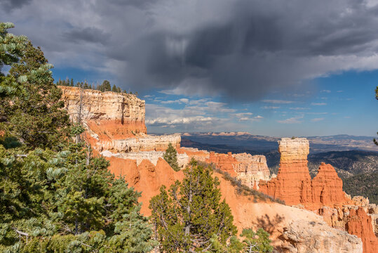 Bryce Canyon hoodoos under dramatic dark storm clouds