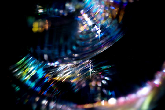 Lights blurred background, motion colorful bokeh, glowing background. Holiday city abstract defocused colorful backdrop. Bright vivid blurred colourful New Year holiday bokeh