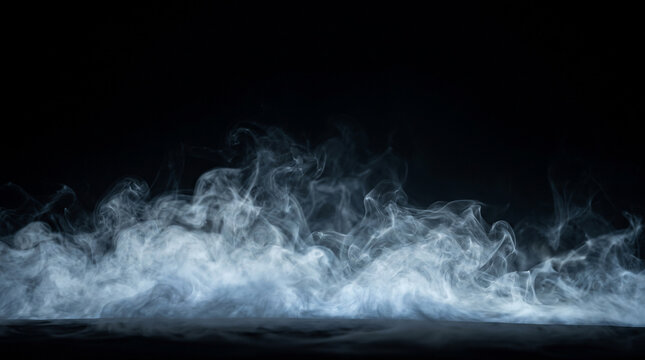 White smoke and fog effect photo. Wispy vapor clouds rolling across the dark floor surface. Atmospheric overlay photography for dramatic mood, mysterious scene, and special effects.