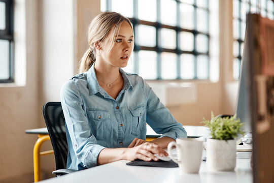 Creative, woman and research in office with computer, media release and public relations internship. Intern, person and browse in business with desktop, monitor news or blog website for PR statement.