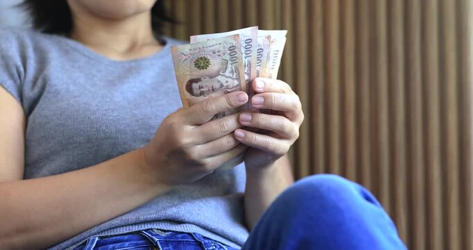 Female hands counting banknotes, personal finance, budgeting, savings, cash payment, expense management, and everyday financial planning, close-up