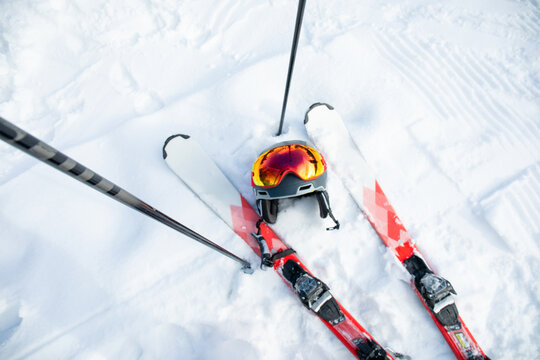 Ski gear placed on pristine snow at a ski resort. Winter sports adventure concept