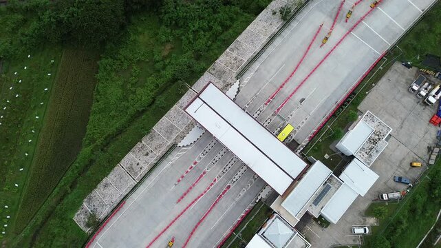 Aerial VIDEO view of a concrete road with highway and toll booth or toll gate, Klaten Indonesia