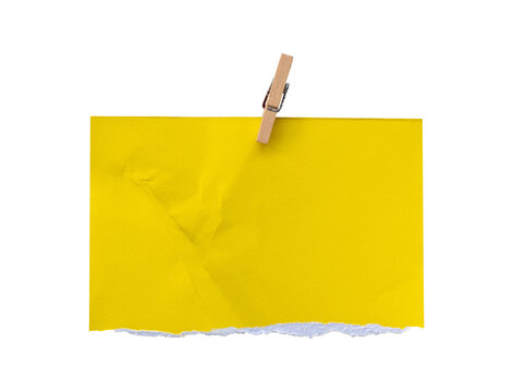 crumpled yellow sticky note with pushpin