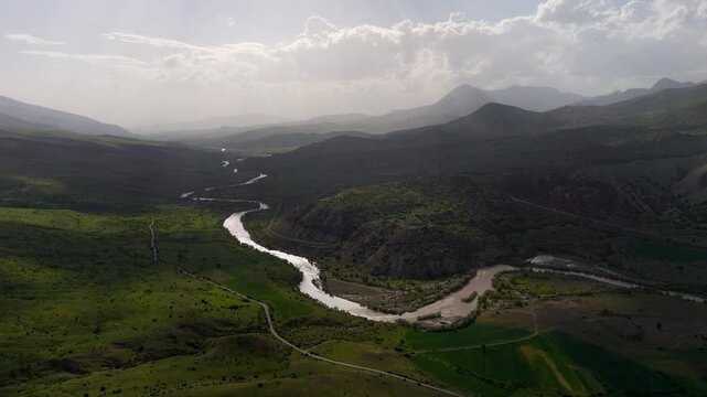 Winding river cuts through lush green valleys (Karasu Erzincan)