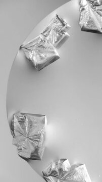 Microscopic view of sodium chloride crystallization as salt solution evaporates, forming transparent geometric crystals and crystalline structures on glass slide