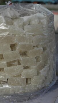 Traditional Indian sweet white petha packed in plastic bag at market stall