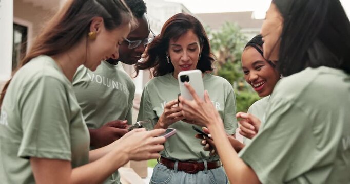 Volunteer, laughing and people with phone, outdoor and social responsibility for community service. NGO, friends and happy team with mobile, humor and reading funny post on web or bonding on break