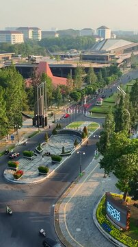 Symmetrical aerial view along green UGM Boulevard in Yogyakarta