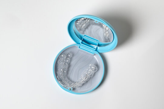 Clear aligners in blue case for orthodontics and dental care