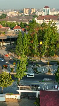 Urban roundabout beside UGM Boulevard and Yogyakarta city buildings
