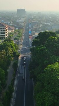 Aerial vertical view along busy urban avenue in Yogyakarta