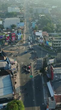 High angle city view of major Yogyakarta crossroads with moving traffic
