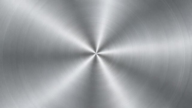 Brushed metal texture background with circular pattern and shiny silver surface