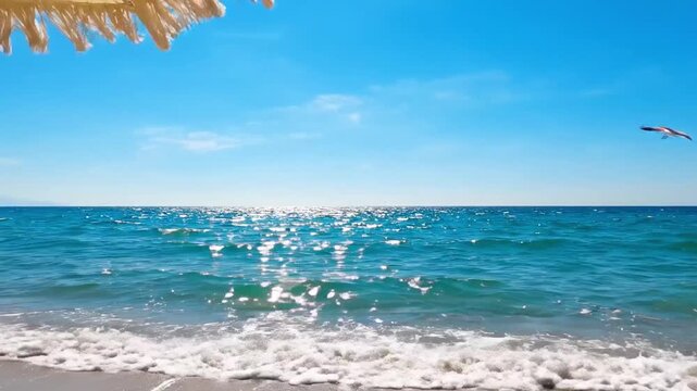 Sparkling ocean waves at beach in bright summer background