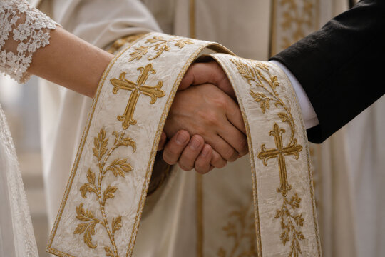 Blessed Hands Under Priest&rsquo;s Stole &ndash; Church Wedding and Christian Marriage Vows