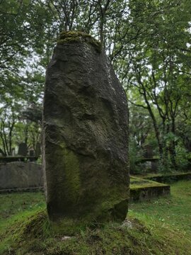 old stone cross in cemetery
