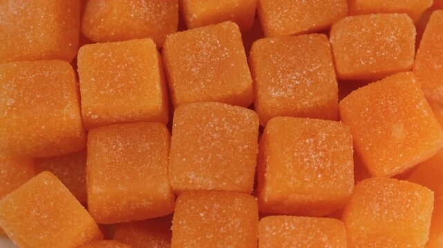 Zoom frame yellow cubes creatine gummies close up, rotation