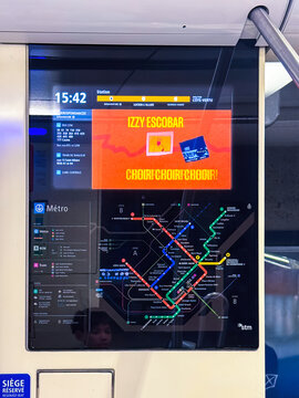 Montreal, Quebec, Canada. September 18, 2026. An interactive metro map and info screen inside an STM public transit subway car.
