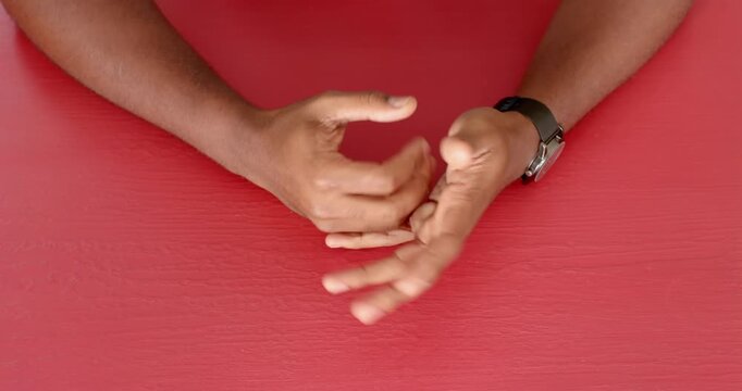 Close up of people talking to the camera, gesturing with hands, person wearing wristwatch on red tab