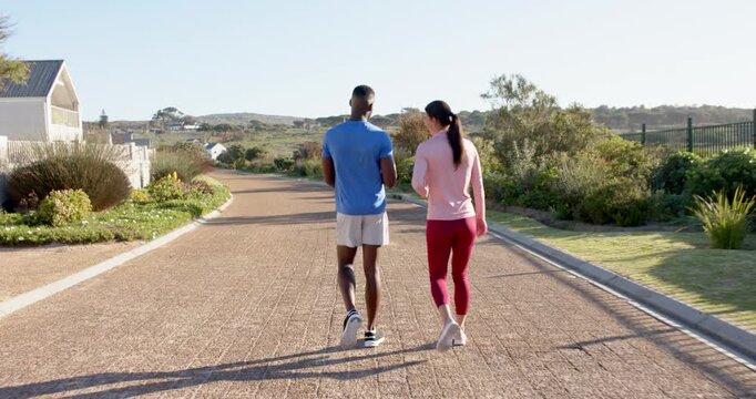 Lifestyle videos outdoor of people doing activities, walking outdoors, man and woman exercising toge