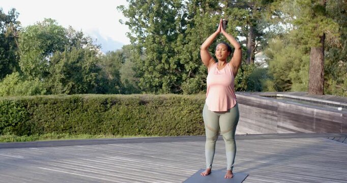 Lifestyle videos outdoor of people doing activities, practicing yoga, woman in plank position on yog