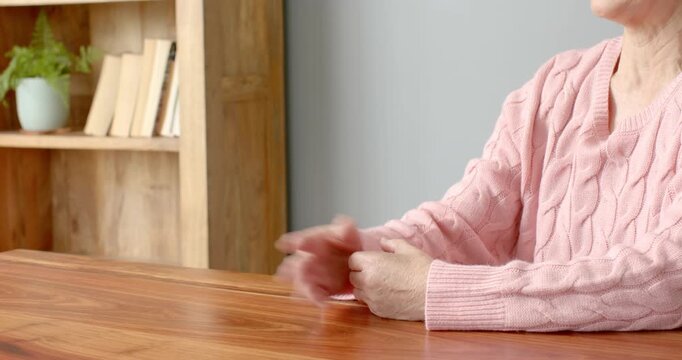 Close up of people talking to the camera, senior woman gesturing with hands