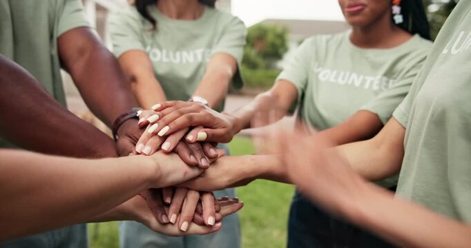 Volunteers, clapping or team outdoor with handstack, support or motivation in donation campaign. Happy people, diversity or charity group with applause, encouragement or solidarity in welfare project