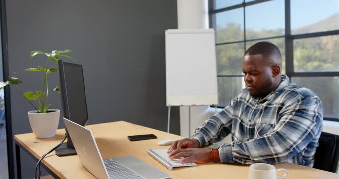 Lifestyle videos indoor of people doing activities at office, working at desk, man using computer mo