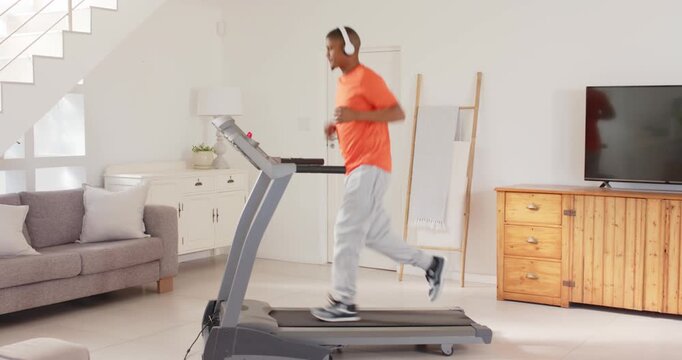 Lifestyle videos indoor of people doing activities at home, running on treadmill at home, man wearin