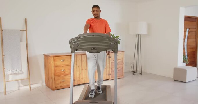 Lifestyle videos indoor of people doing activities at home, exercising at home, man walking on tread