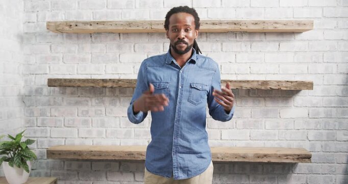 Close up of people talking to the camera, business professional in denim shirt speaking