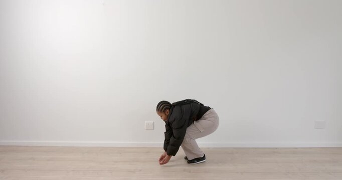 High speed photography for dynamic scenes, Squatting and balancing, person in casual clothing perfor