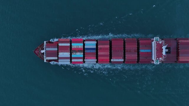 cargo ship carrying container and running for export goods from cargo yard port to custom ocean concept technology transportation. container ship export import shipping service.