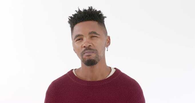 African American man in red sweater expressing confusion against white background