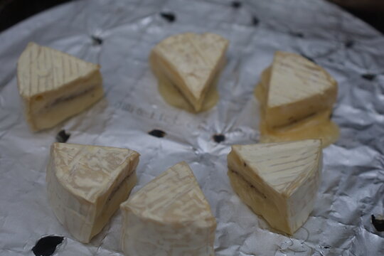 Triangular Pieces of White Cheese on Aluminum Foil Outdoor Camping Food