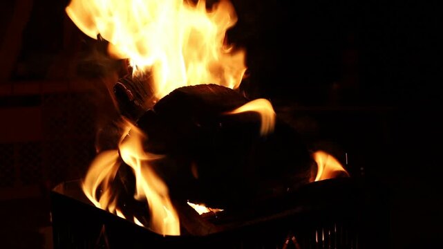Dramatic Campfire Burning with Bright Orange Flames Outdoor Camping Night